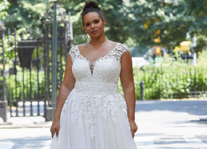 Plus size model wearing a Bridal Gown